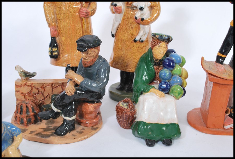 A collection of naive clay pottery figurines being hand painted and glazed in the manner of Royal - Image 4 of 5