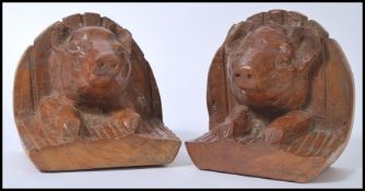 A pair of unusual hard carved wooden butchers shop display - ham fronts being in the form of pigs