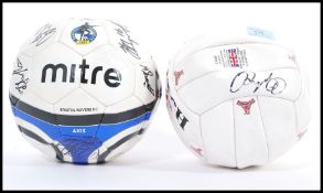 A signed Bristol Rovers F.C. football including signatures from Scott McGleisch and Matt Gill, along