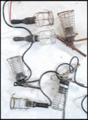 A group of six vintage retro 20th century cage / trouble inspection lamps having wire cages. Three