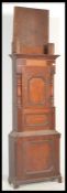 A 19th century mahogany clock body with a panelled door and moulded detailing. Measures: 218cm
