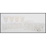 A collection of Edinburgh cut glass crystal glasses, together with a set of four wine glasses