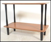 A vintage retro 20th century teak two tier buffet stand / side table raised on cylindrical
