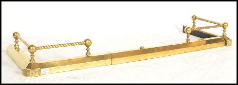 A 19th century Victorian brass adjustable kerb fire fender guard having metamorphic action and