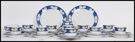 A vintage early 20th century Nippon hand painted tea service having cobalt and gilt decoration and