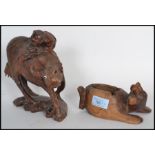 Two early 20th century carved Chinese wooden figurines to include an ox on plinth base with man