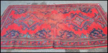 A 19th Century Baluch hand woven floor rug, Timuri, last quarter 19th century, on red ground with