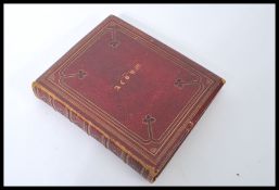 A Victorian 19th century red leather gilt tooled b