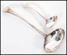 A pair of graduating silver hallmarked ladle's having curved handles. Hallmarked Sheffield, date
