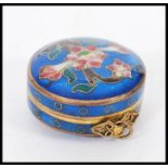 A 19th century Chinese cloisonne pill pot box on pendant bale hoop. Deep blue ground with decoration