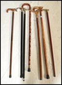 A group of vintage walking stick canes to include horn handled example, one with place crests,
