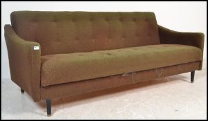 A  retro 1960's sofa settee / day bed in the manner of Greaves and Thomas, Raised on tapering