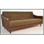 A  retro 1960's sofa settee / day bed in the manner of Greaves and Thomas, Raised on tapering
