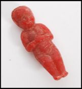 A rare 19th Century red soap doll in the form a baby distributed as a novelty advertising item
