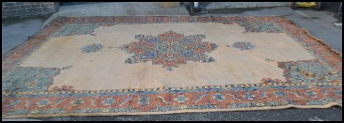 A large early 20th Century circa 1930's Ushak full pile wool floor rug believed to have been