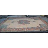 A large early 20th Century circa 1930's Ushak full pile wool floor rug believed to have been