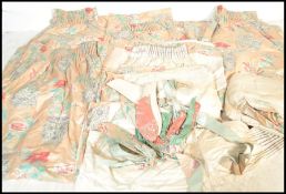 A good set of eight curtains all in high quality silk like fabric with chintz floral sprays and