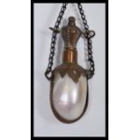 A Victorian French Mother of Pearl chatelaine stoppered perfume bottle with etched metal mounts