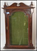 A 19th century Victorian mahogany wall mounted display cabinet / notice board having swan pediment