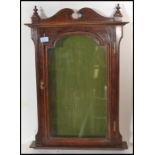 A 19th century Victorian mahogany wall mounted display cabinet / notice board having swan pediment