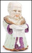 A 19th century Conta & Boehme porcelain tobacco jar & cover depicting a robed man reading The