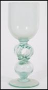 A very large early 19th century Georgian tall wine glass boblet raised on a spread circular foot