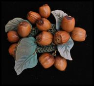 A 1930s Miriam Haskell / Frank Hess cluster brooch pin having carved wooden hazelnuts sewn to a