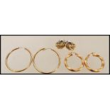 A selection of 9ct gold earrings to include hoop, twisted hoop and stud earrings. Weight 6.0g.