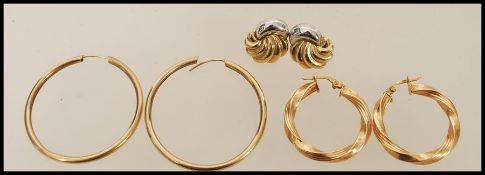 A selection of 9ct gold earrings to include hoop, twisted hoop and stud earrings. Weight 6.0g.