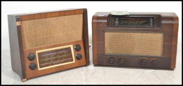 Two 1940's walnut cased valve radios, each with decorative facia and dials, one in light walnut, the