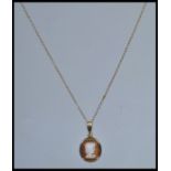 A 20th century 9ct gold hallmarked ladies cameo pendant and necklace chain, weight 2.0g  length of