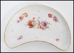 A 19th century Berlin porcelain KPM serving plated hand painted with floral sprays and gilt