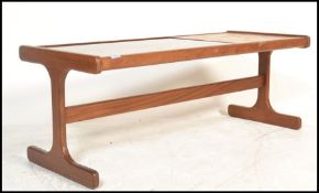 A retro 20th Century G-Plan teak wood coffee table with tile inset top flanked by drop in glass