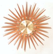 AFTER GEORGE NELSON A CONTEMPORARY STARBURST WALL CLOCK