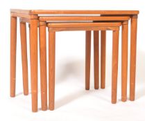 A MID CENTURY SOLID TEAK DANISH INFLUENCE NEST OF TABLES