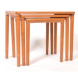 A MID CENTURY SOLID TEAK DANISH INFLUENCE NEST OF TABLES