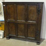 An antique low cupboard the rectangular top above a single door, the interior fitted with shelves,