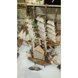 A wooden model of HMS Victory, on stand, 50cm long, 45cm high and four other ships models, (5).