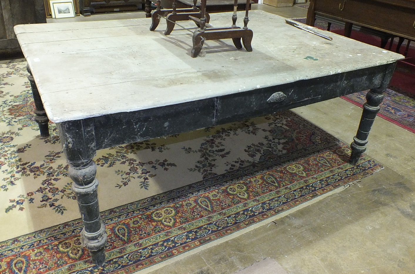 A large 19th century rectangular scrub top pine kitchen table with frieze drawer and turned legs,