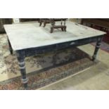 A large 19th century rectangular scrub top pine kitchen table with frieze drawer and turned legs,