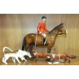 A Beswick model, Huntsman, style two, standing, 21cm, brown gloss, two foxes, standing and two