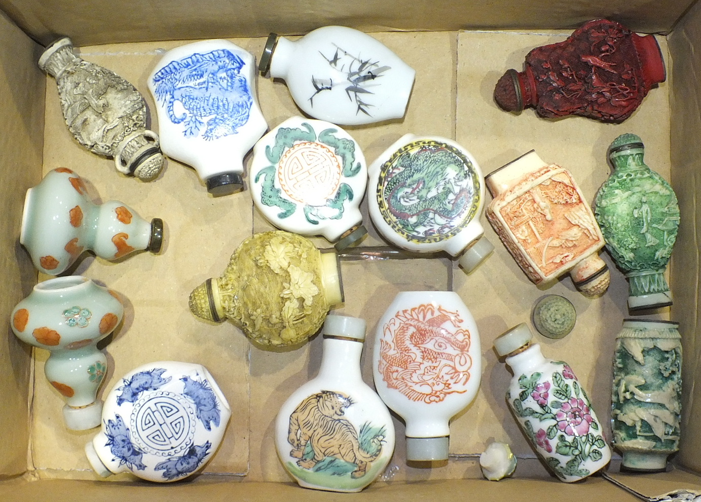 A collection of sixteen 20th century Oriental ceramic and composite snuff bottles, (16).