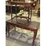 A 19th century mahogany two-drawer writing table, the top with inset writing surface above two