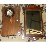 A Georgian-style mahogany and parcel gilt wall mirror, 40 x 70cm, an Edwardian two-handled concave-