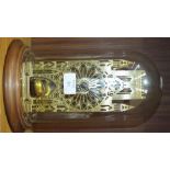 A Hermle Franklin Mint York Minster Cathedral skeleton clock on circular wooden base with glass