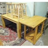 A modern oak effect kitchen table, four wood stools and other modern furniture.