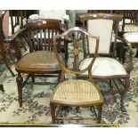 An Edwardian inlaid mahogany armchair an elm office armchair and other chairs.