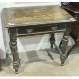 An early 20th century oak side table, the rectangular top above a frieze drawer, on turned legs,