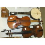 A full-size violin with paper label, Apres Guarelagnini Lorengo, another violin, a bow, a small