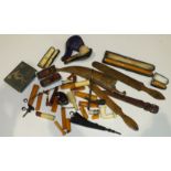 Two "Jerusalem" wooden paper knives, various cigar and cigarette holders (af), and other items.